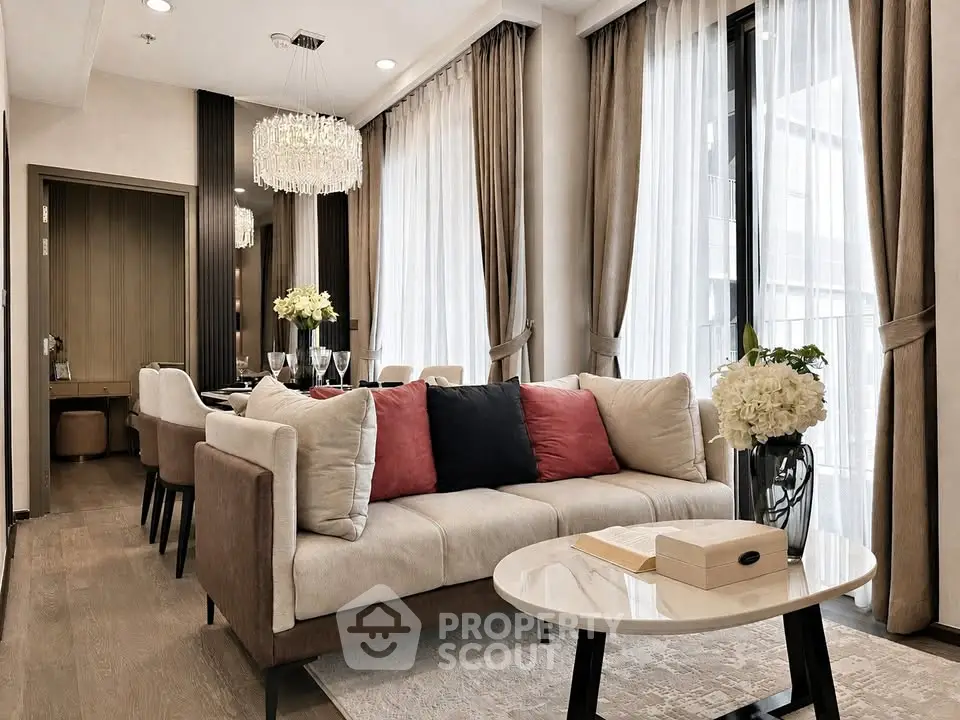Luxurious modern living room with elegant decor and large windows