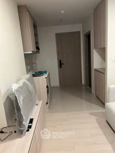 Modern apartment interior with sleek kitchen and cozy living area