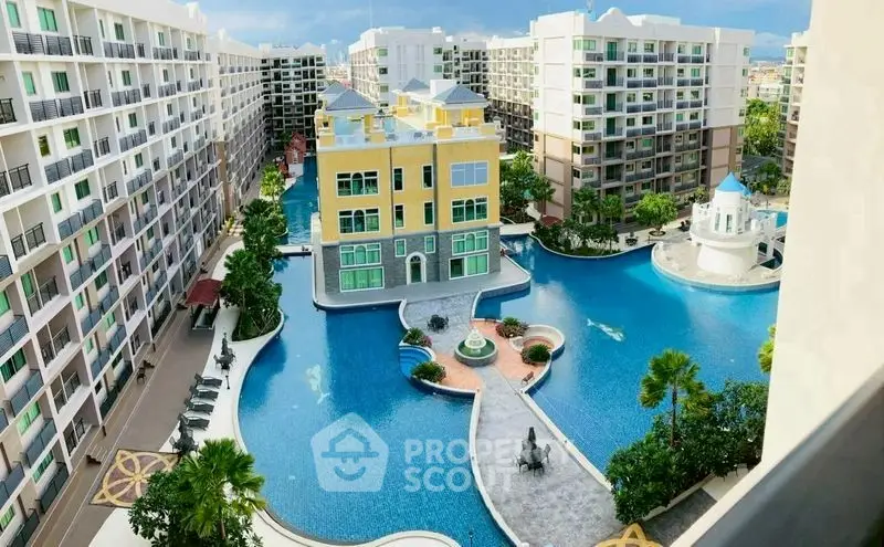 Luxurious apartment complex with stunning pool and modern architecture.