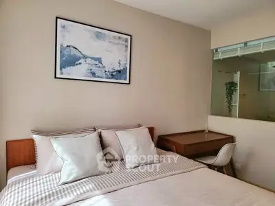 Cozy bedroom with modern decor and study desk, perfect for relaxation and productivity.
