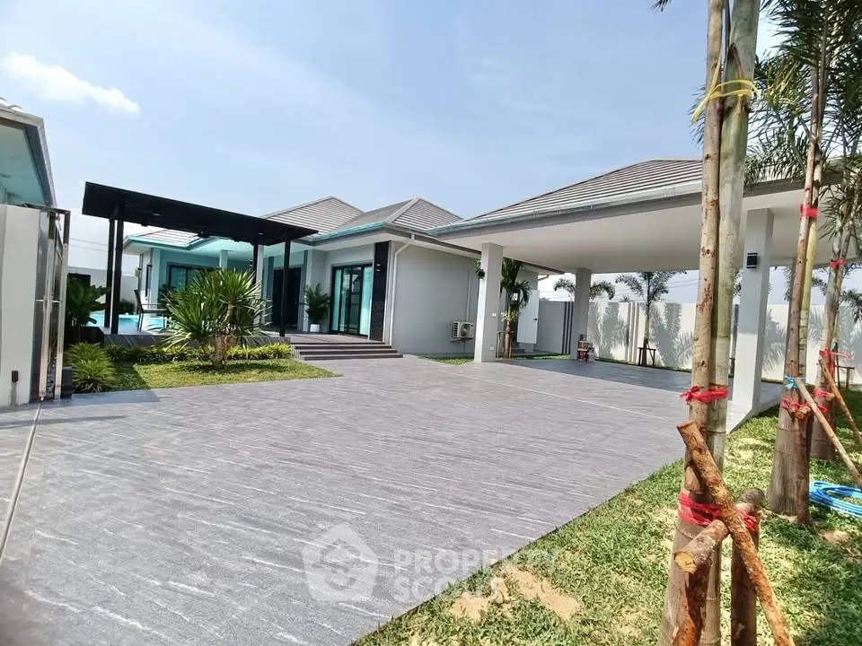 Stunning modern villa with spacious driveway and lush garden