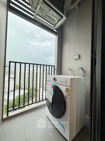 Modern balcony with washing machine and city view, perfect for urban living convenience.