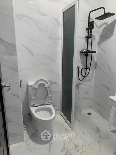 Modern bathroom with sleek marble tiles and contemporary fixtures