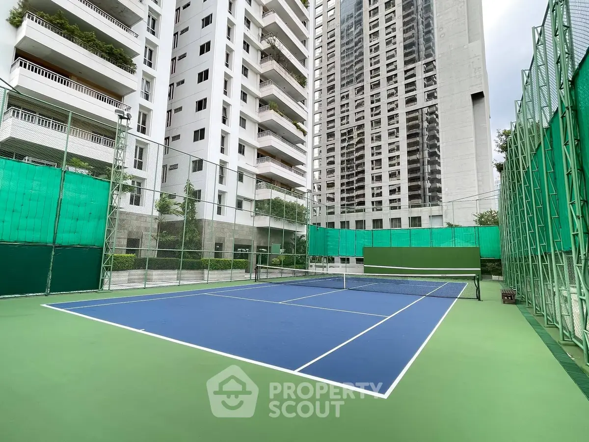 Luxurious high-rise apartment with tennis court and modern amenities