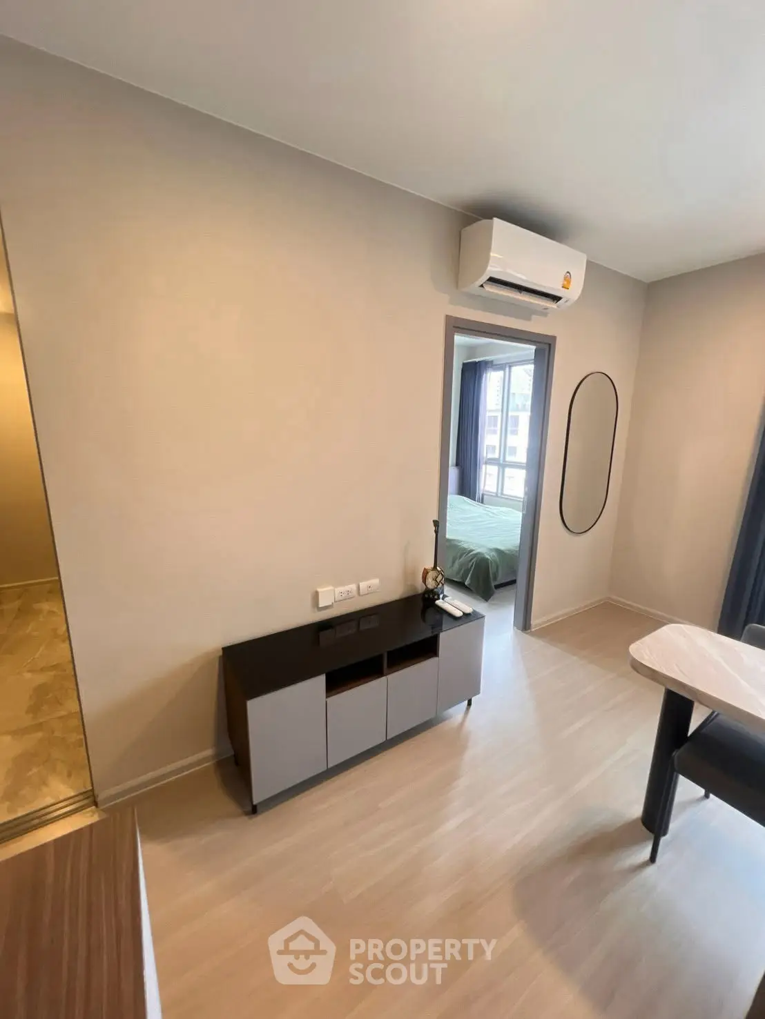 Modern apartment interior with air conditioning and sleek furniture, showcasing a cozy and stylish living space.