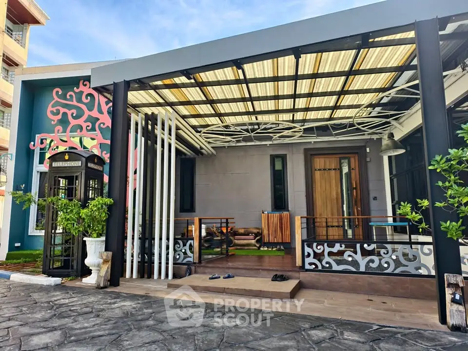 Modern house exterior with stylish patio and unique design elements