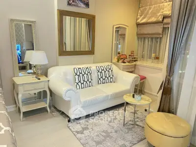 Charming living room with elegant white sofa and stylish decor