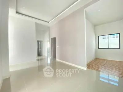 Spacious modern interior with high ceilings and sleek tile flooring