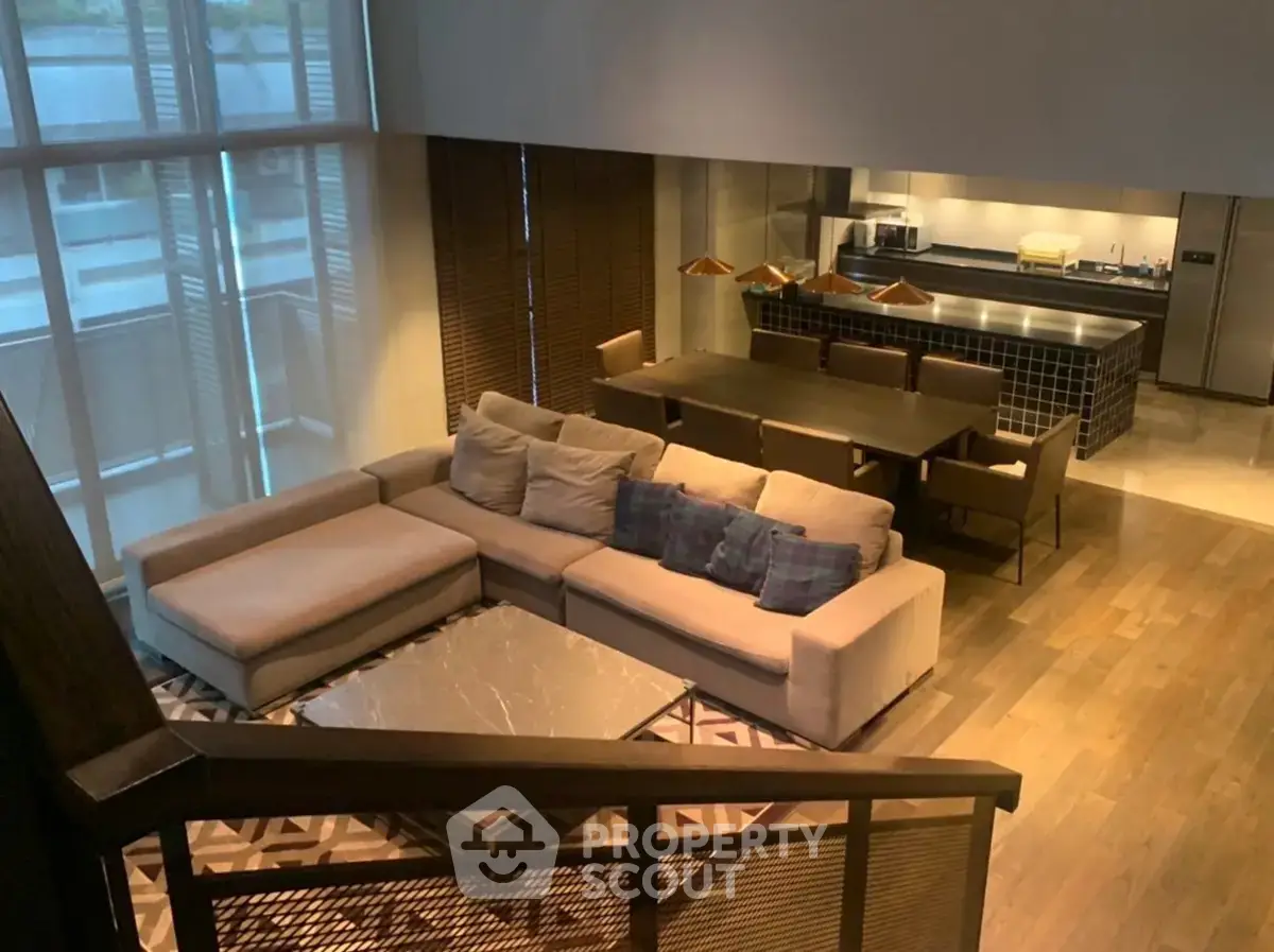 Spacious modern living room with open kitchen and stylish decor