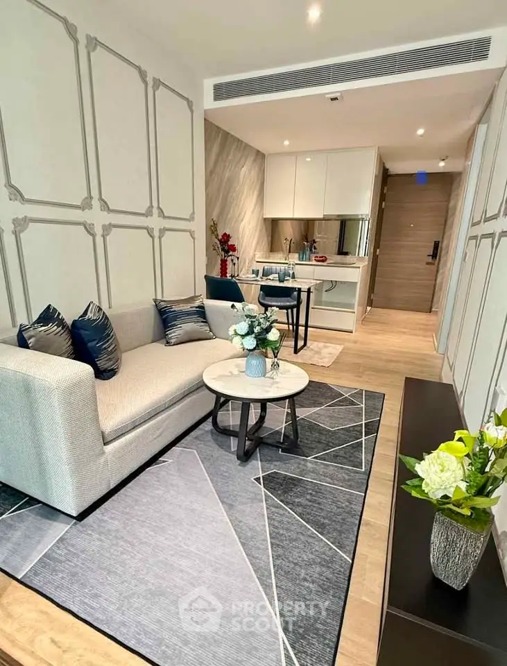 Modern living room with stylish decor and open kitchen layout