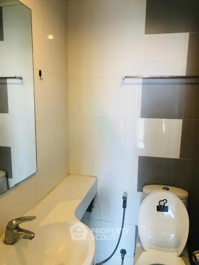 Modern bathroom with sleek fixtures and stylish tile design