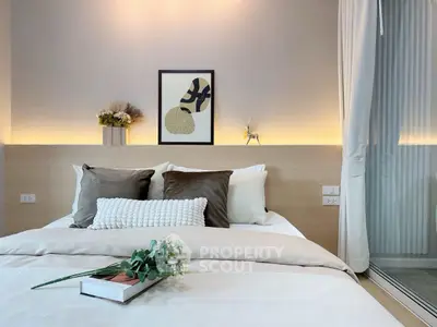 Modern bedroom with elegant decor and soft lighting, featuring a cozy bed and stylish artwork.