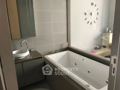 Modern bathroom with sleek bathtub and stylish fixtures
