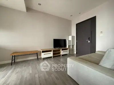 Modern minimalist living room with sleek furniture and wooden flooring