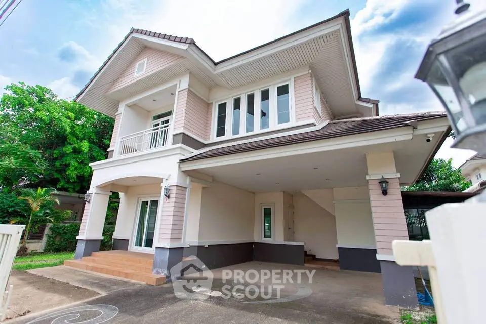 Stunning two-story house with spacious driveway and elegant architectural design.