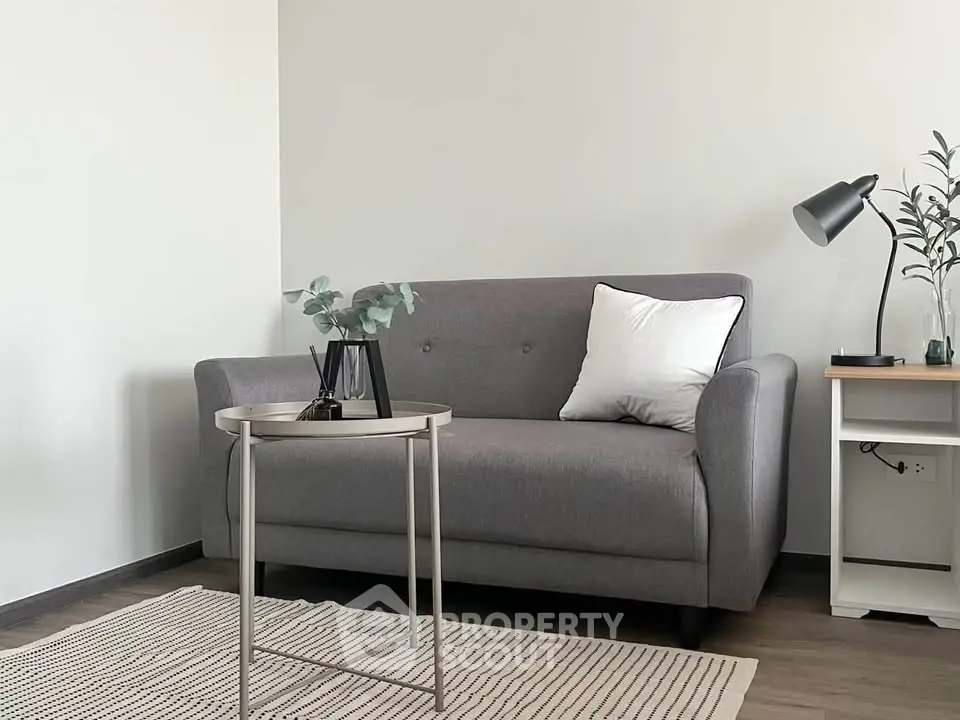 Modern living room with stylish gray sofa and sleek decor