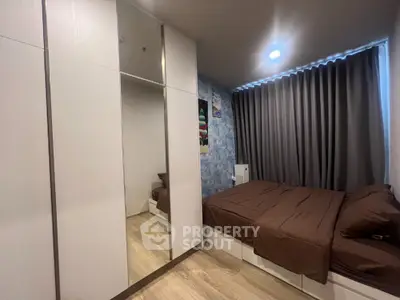 Cozy bedroom with modern decor and ample storage space