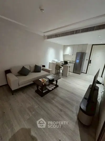 Modern living room with open kitchen and stylish decor