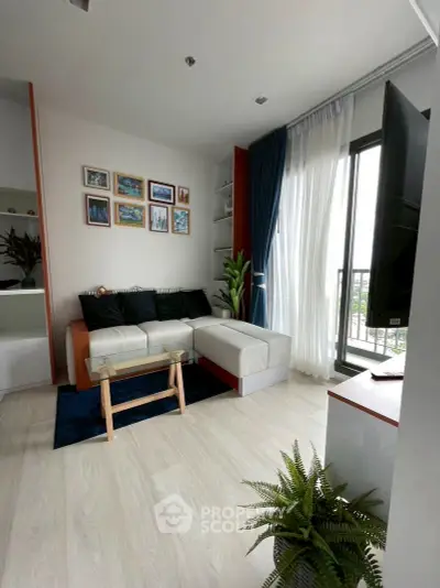 Modern living room with stylish decor and large window view