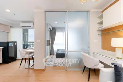 Modern apartment interior with open layout, featuring a cozy bedroom and stylish living area.