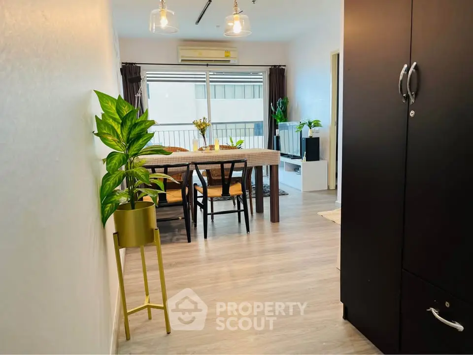 Charming dining area with modern decor and natural light, perfect for cozy gatherings.