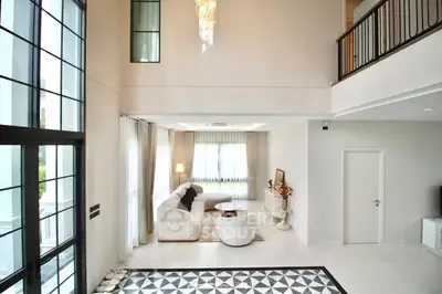 Luxurious modern living room with high ceilings and elegant decor