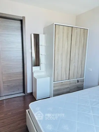 Modern bedroom with sleek wardrobe and minimalist design