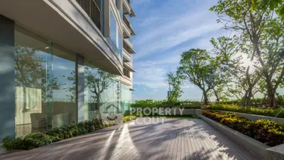 Luxurious modern building with spacious balcony and stunning garden view.