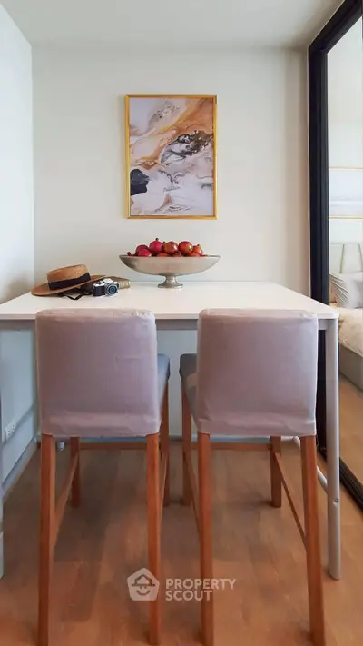 Chic dining nook with stylish chairs and elegant decor in modern apartment