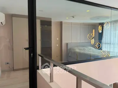 Modern bedroom with glass wall and elegant lighting in a stylish apartment