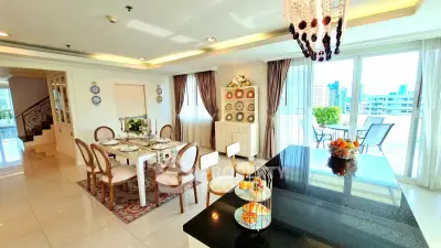 Luxurious dining area with elegant decor and city view, perfect for entertaining guests.
