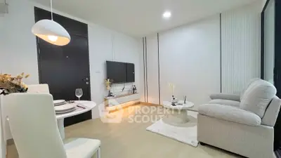 Modern living room with cozy seating and stylish decor in a contemporary apartment.