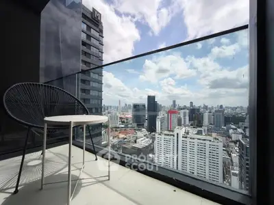 Stunning city view from a modern balcony with sleek furniture, perfect for urban living.
