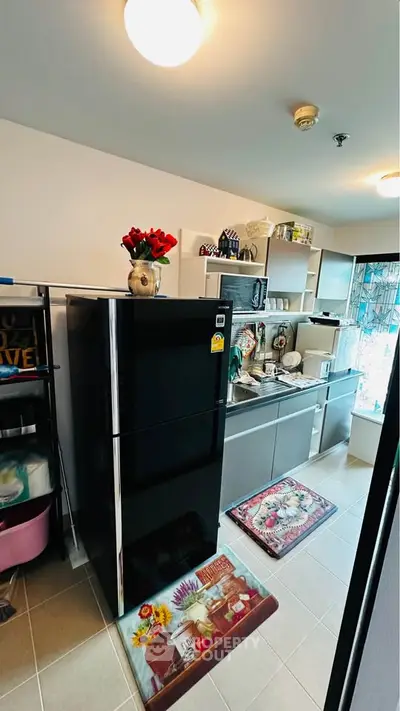 Modern kitchen with sleek appliances and stylish decor, featuring a spacious layout and contemporary design.