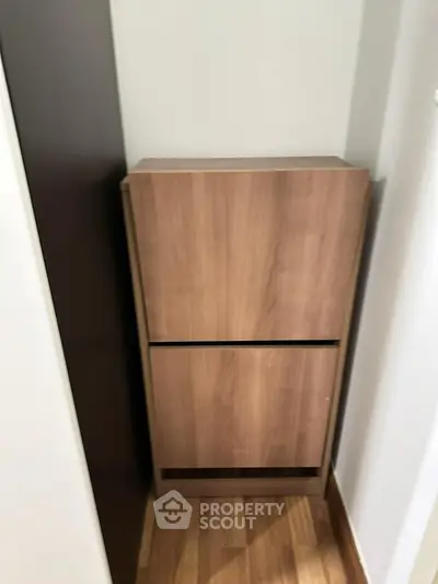 Compact wooden storage unit in a modern interior space