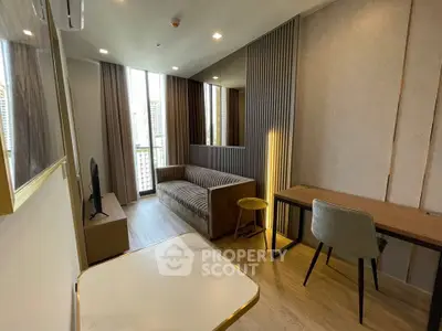 Modern living room with stylish decor and city view, featuring a cozy sofa and sleek furniture.