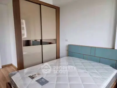 Modern bedroom with stylish wardrobe and comfortable bed