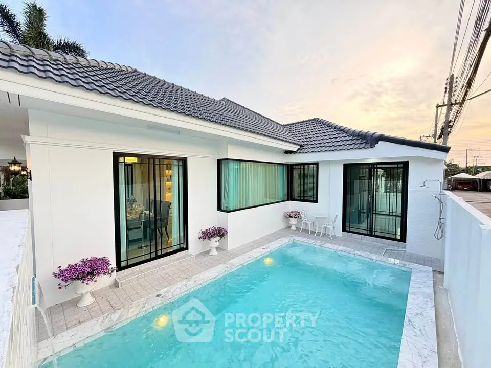 Stunning modern home with private pool and elegant exterior design.