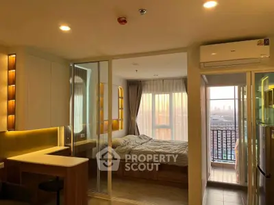 Modern studio apartment with sunset view, featuring cozy bedroom and open kitchen layout.