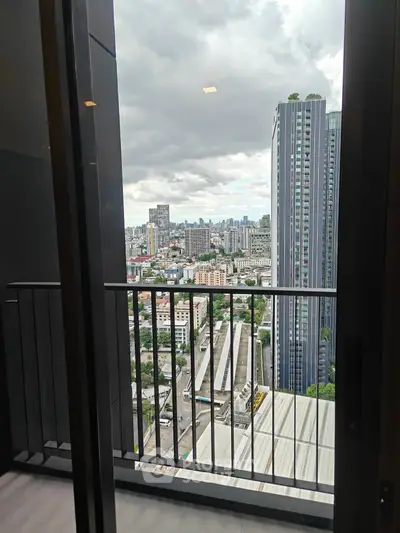 Stunning cityscape view from a high-rise balcony, perfect for urban living enthusiasts.