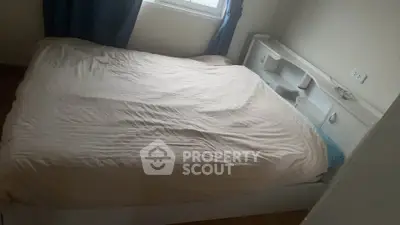 Cozy bedroom with natural light and minimalist decor