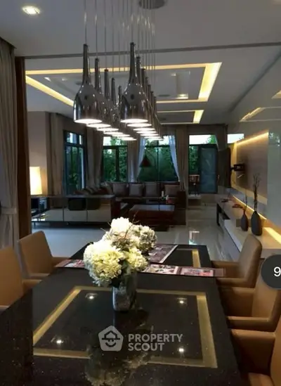 Luxurious modern living room with elegant lighting and spacious seating area.