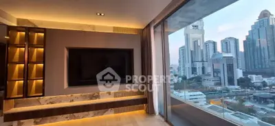 Luxurious living room with stunning city view and modern built-in entertainment center.