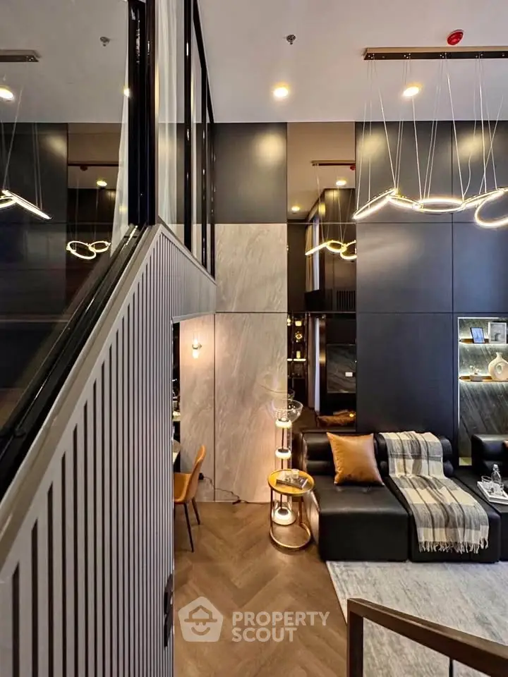 Luxurious modern living room with high ceilings and elegant lighting fixtures