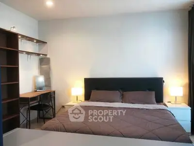 Modern bedroom with cozy lighting and stylish furniture, perfect for relaxation and comfort.