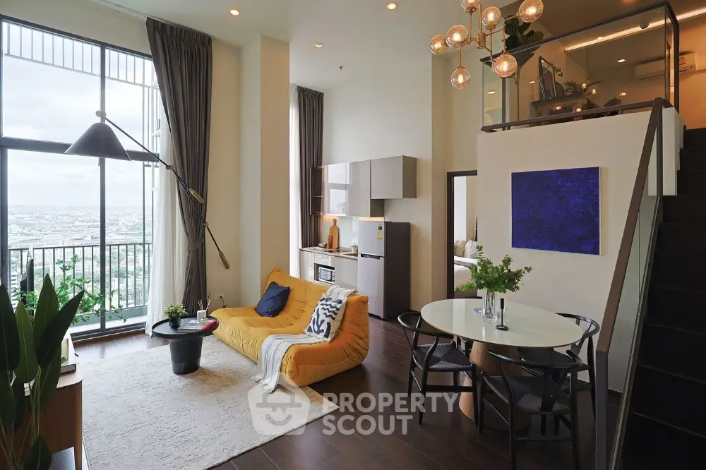 Modern loft apartment with high ceilings and large windows offering stunning city views.