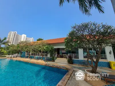 Stunning poolside view with lush greenery and modern architecture