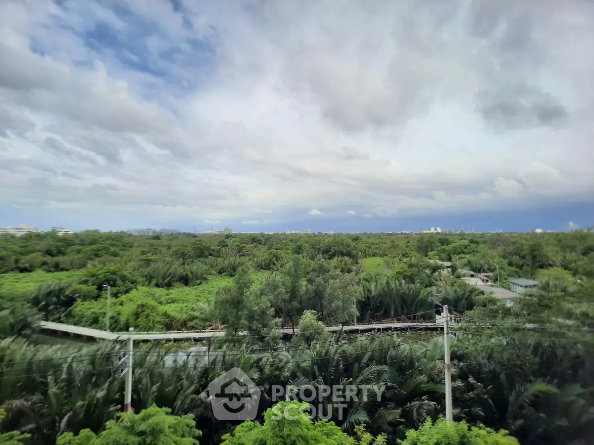 Stunning panoramic view of lush greenery and expansive sky, perfect for nature lovers seeking tranquility.