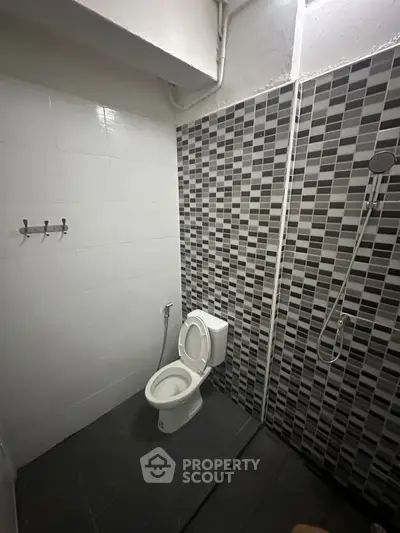 Modern bathroom with stylish tile design and shower area