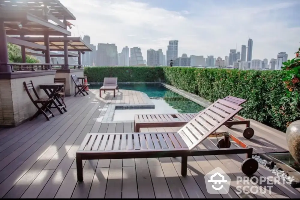 Luxurious rooftop pool with city skyline view and stylish wooden loungers